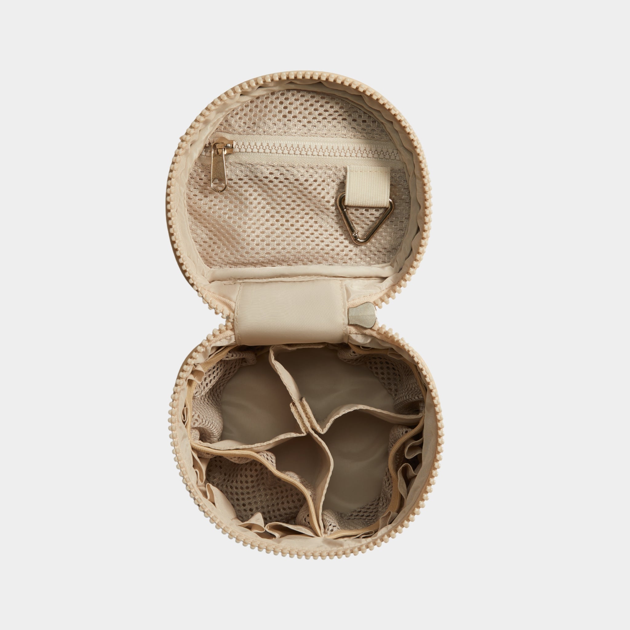 Beige tote with open lid on a light beige background