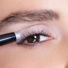 Close-up of an eye with color dove eyeliner being applied