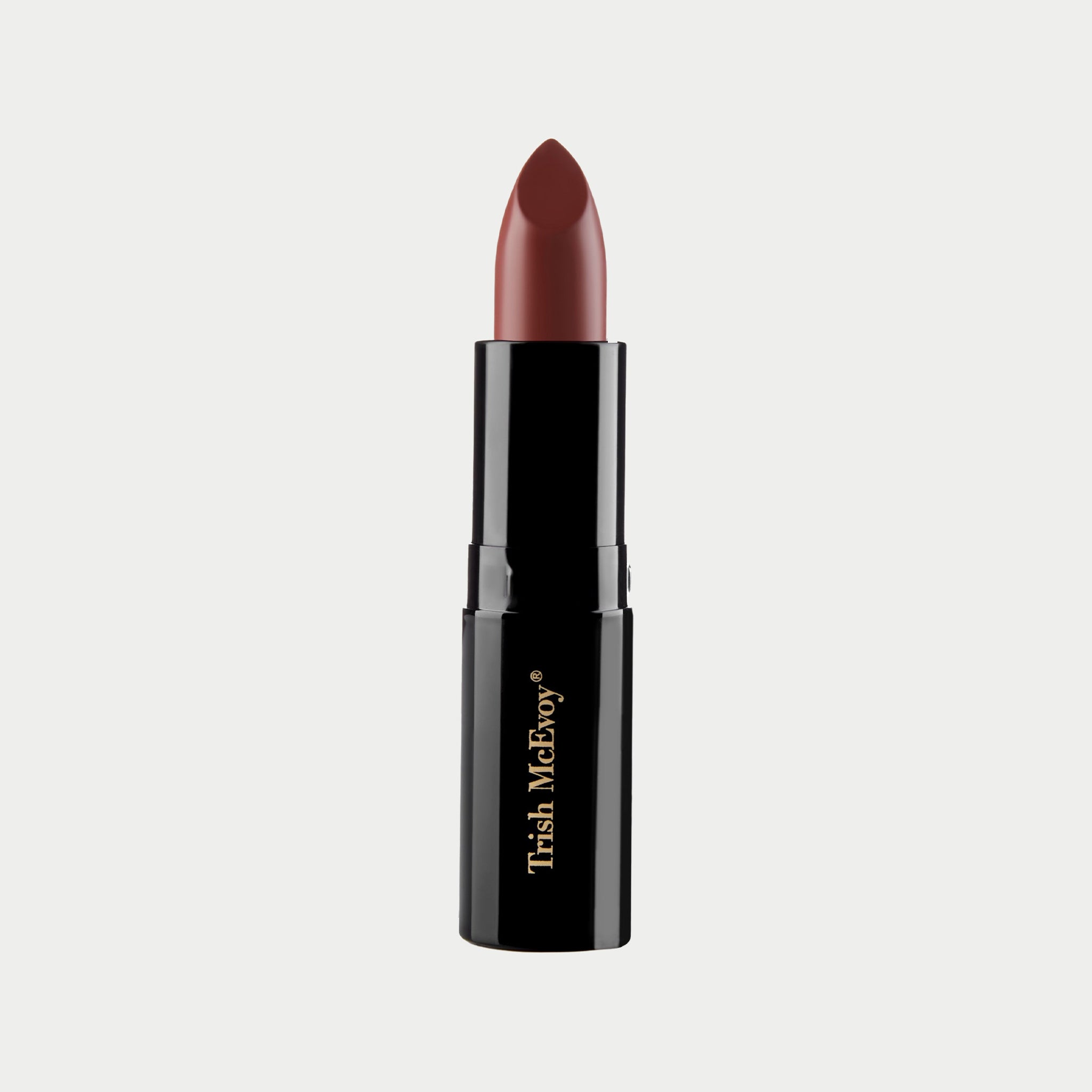 Lipstick with black casing and visible brand name on a light gray background