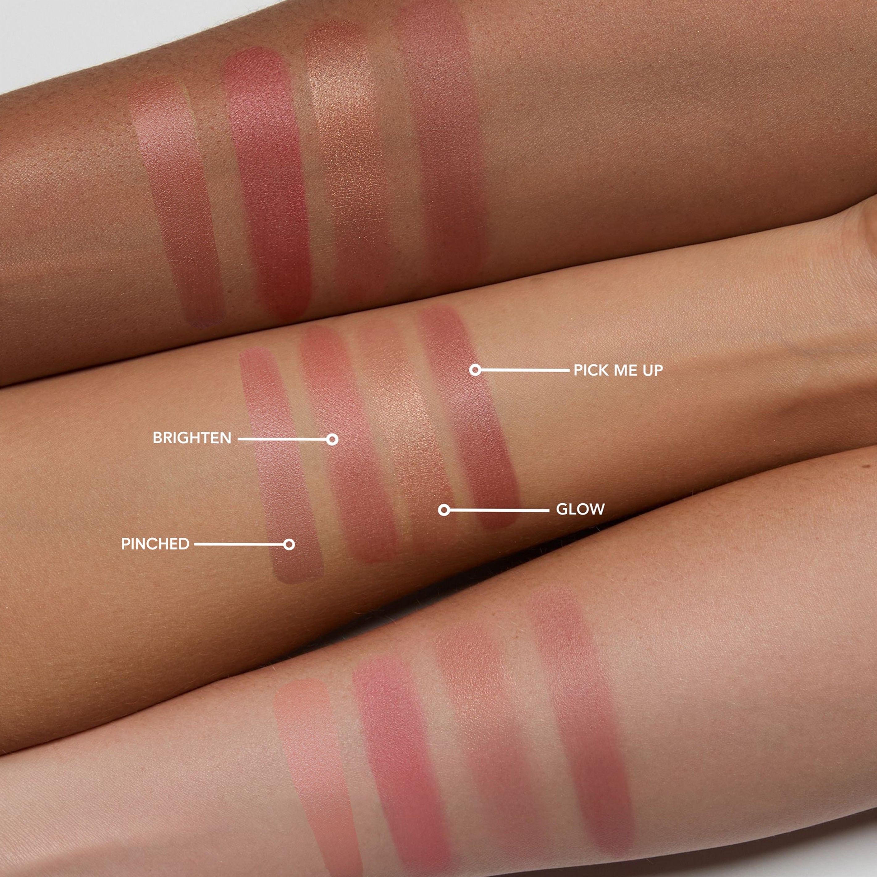 Liquid face color swatches on a person's arm with labeled shades.