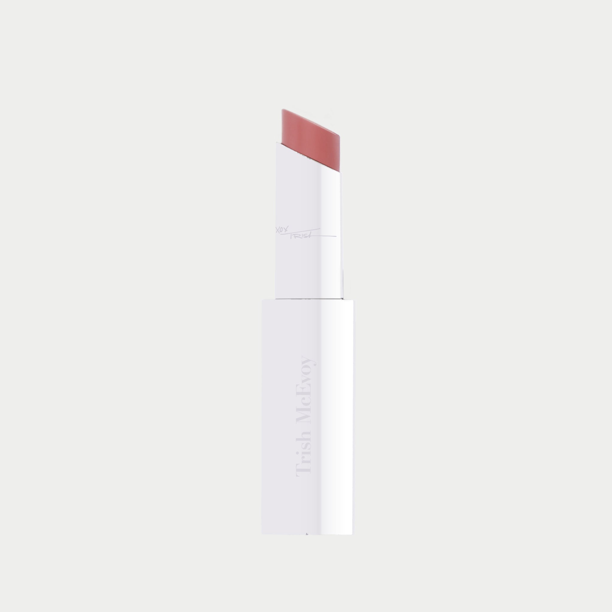 White cylindrical lip balm tube with mauve-pink color swatch on top edge against neutral background.