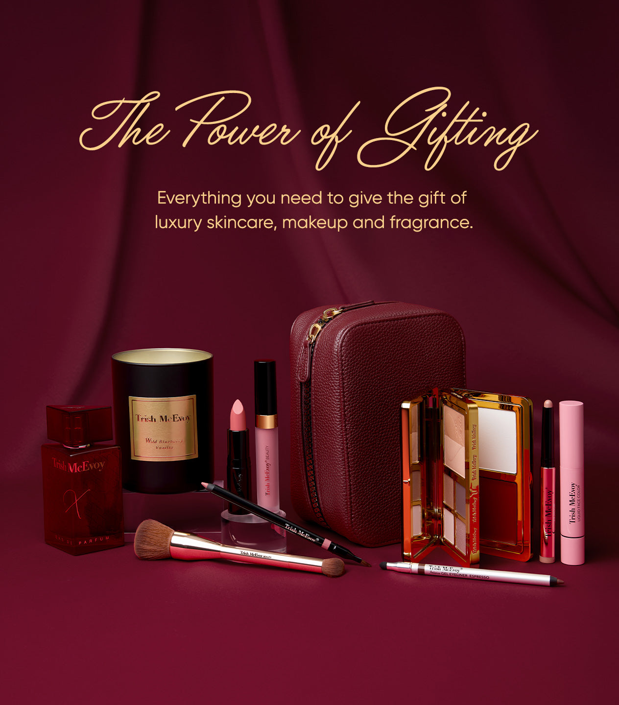 Makeup and skincare products with a maroon bag on a matching background, featuring text about luxury gifting.